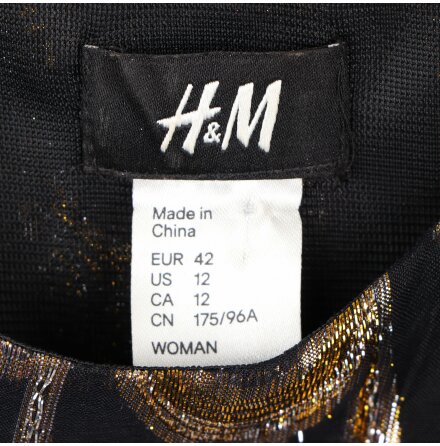 H&amp;M - Svart klnning med glitter i guld och silver - stl. 42