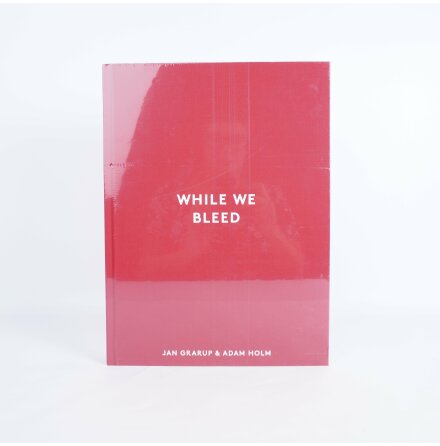 While We Bleed - Jan Grarup och Adam Holm